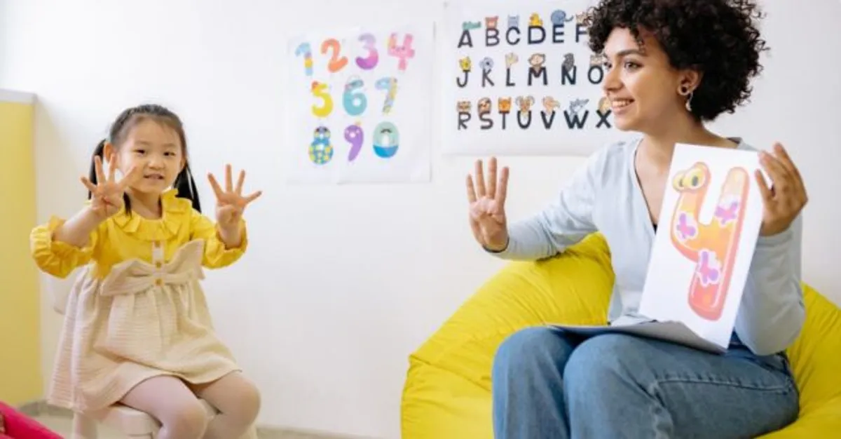 Teacher engaging with a child in a classroom