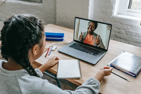 A child taking an online tutoring session