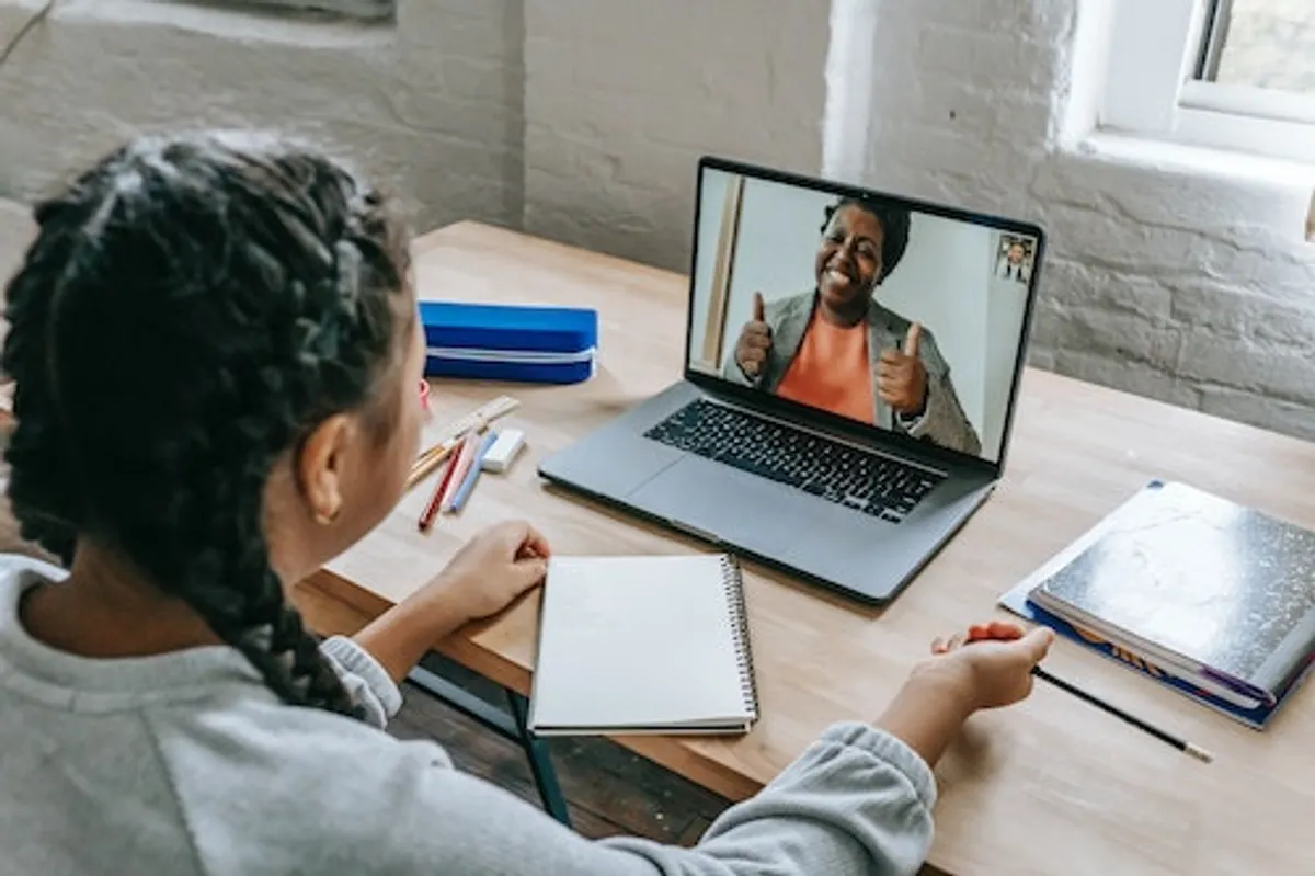 A child taking an online tutoring session